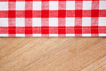 Image showing checkered tablecloth on wooden table