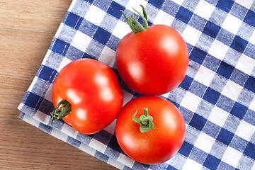 Image showing red tomatoes on table