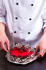 Image showing Confectioner and a cake