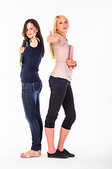 Image showing Two beautiful student girls showing thumbs up