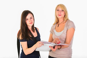 Image showing Two beautiful student girls getting ready for school