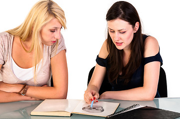 Image showing Two beautiful student girls getting ready for school