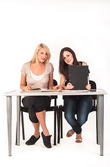 Image showing Two beautiful student girls getting ready for school