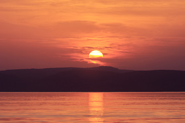 Image showing Sunset at the beach with red sky