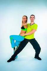 Image showing Acrobatic dancing with two young trainers