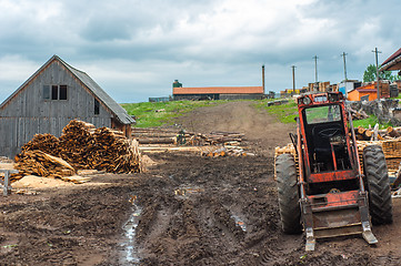 Image showing Wood industry outdoorsm with red tractor