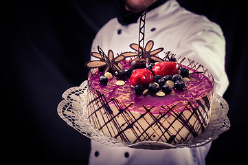 Image showing Confectioner and a cake