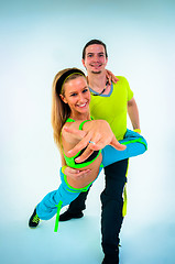 Image showing Acrobatic dancing with two young trainers