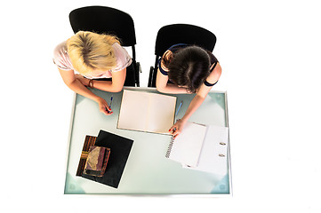 Image showing Two beautiful student girls getting ready for school