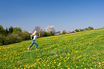 Image showing happy young woman on meadow