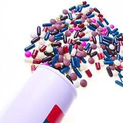 Image showing pills spilling out of container 