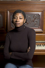 Image showing pretty black woman at piano