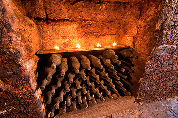 Image showing wine bottles with candles