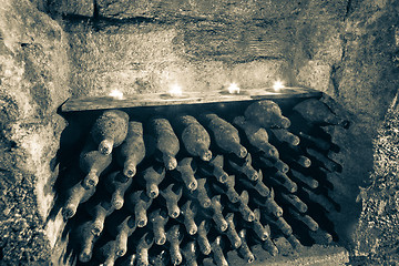 Image showing wine bottles with candles