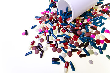 Image showing pills spilling out of container 