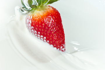 Image showing strawberry splashing into milk