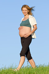 Image showing pregnant woman on meadow