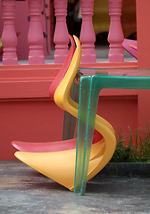 Image showing Two plastic chairs and a table