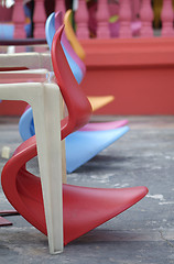 Image showing Row of colourful plastic chairs