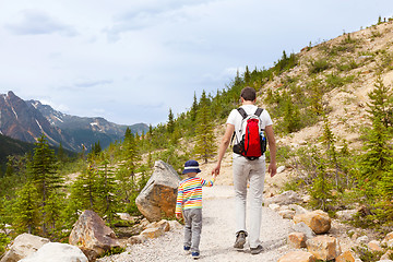 Image showing father and his son walking