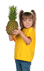 Image showing Little girl with pineapple