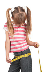 Image showing Little girl with measure
