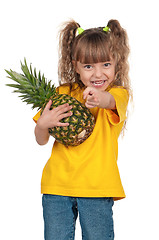 Image showing Little girl with pineapple