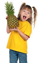 Image showing Little girl with pineapple