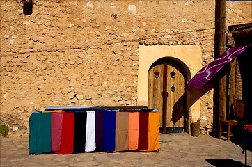 Image showing door market and clothes in tamerza tunisia