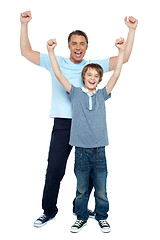 Image showing Father and son celebrating their success