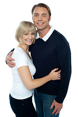 Image showing Stylish man in pullover embracing his blonde wife