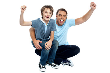 Image showing Joyous father and son cheering loud