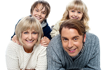 Image showing Spirited kids having fun with their parents indoors