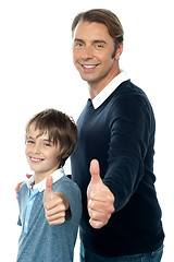 Image showing Confident father and son duo gesturing thumbs up