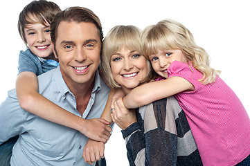 Image showing Happy family of four members posing together