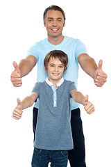 Image showing Handsome father and son showing thumbs up to camera