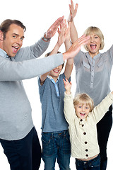Image showing Jubilant family celebrating and partying indoors