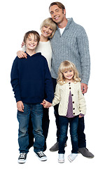 Image showing Cheerfully winter wear family of four. Stay protected