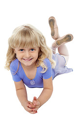 Image showing Sweet little girl posing relaxed on the floor