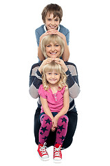 Image showing Mother posing with her adorable son and daughter