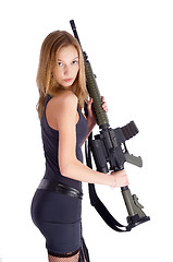 Image showing Woman with gun on white