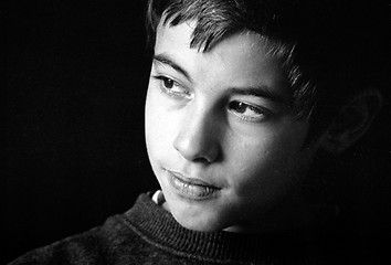 Image showing Boy  by a window