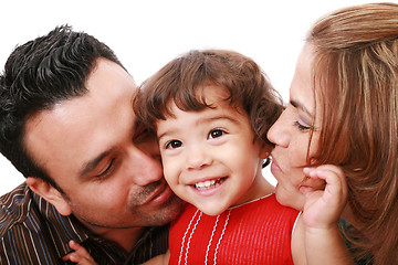 Image showing Parents giving their daughter a kiss. 