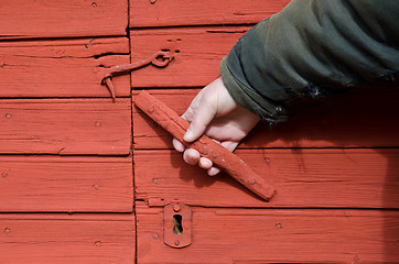 Image showing Old wooden doorhandle