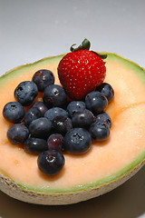 Image showing cantaloupe, blueberries and strawberries