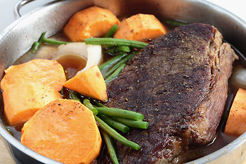 Image showing Pot roast with sweet potato side view