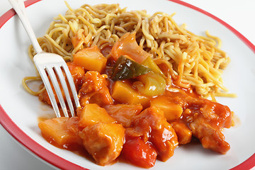 Image showing Chicken sweet and sour with fork