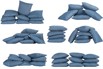 Image showing seven stacks of blue denim pillows