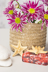 Image showing Spa setting with natural soaps and flower