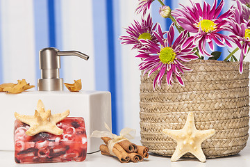 Image showing Spa setting with natural soaps and flower